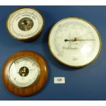 A Taylor American brass cased marine barometer and two other circular aneroid barometers