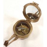 A brass reproduction compass