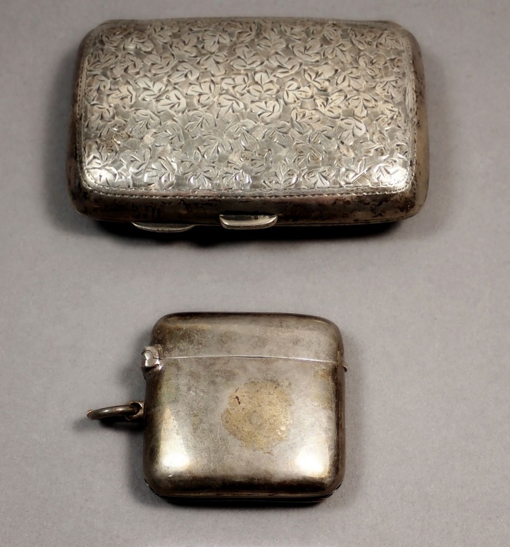 A silver cigarette case, Birmingham 1906, 55g and a silver vesta case, Chester 1913, 32g