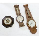 A walnut Art Deco style Short and Mason barometer/thermometer, another barometer/thermometer and