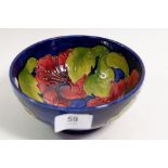 A Moorcroft hibiscus bowl on a blue ground, 16cm diameter