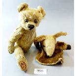 An early 20th century German teddy bear (lacking a leg) and a donkey hand puppet