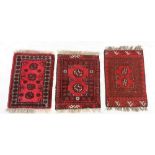 Three small Turkoman style rugs, 50 x 62cm