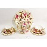 A Royal Worcester Victorian tea service with peony decoration comprising: twelve cups and saucers,