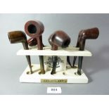 A 'Cuesta Rey' wooden cigar stand and seven various pipes