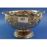 A silver pedestal bowl with embossed spiral and foliage decoration, engraved presentation for