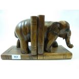 A carved elephant pair of bookends, 20cm tall