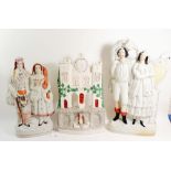 A Victorian Staffordshire large group with man and woman playing harp and squeeze box - 43cm, a