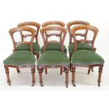 A set of six Victorian mahogany dining chairs on reeded and turned supports