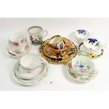 A collection of various cups and saucers including Pekin mug