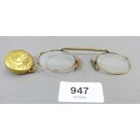 A pair of gold plated spectacles with retractable chain