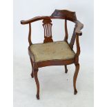 An Edwardian mahogany slat back corner chair