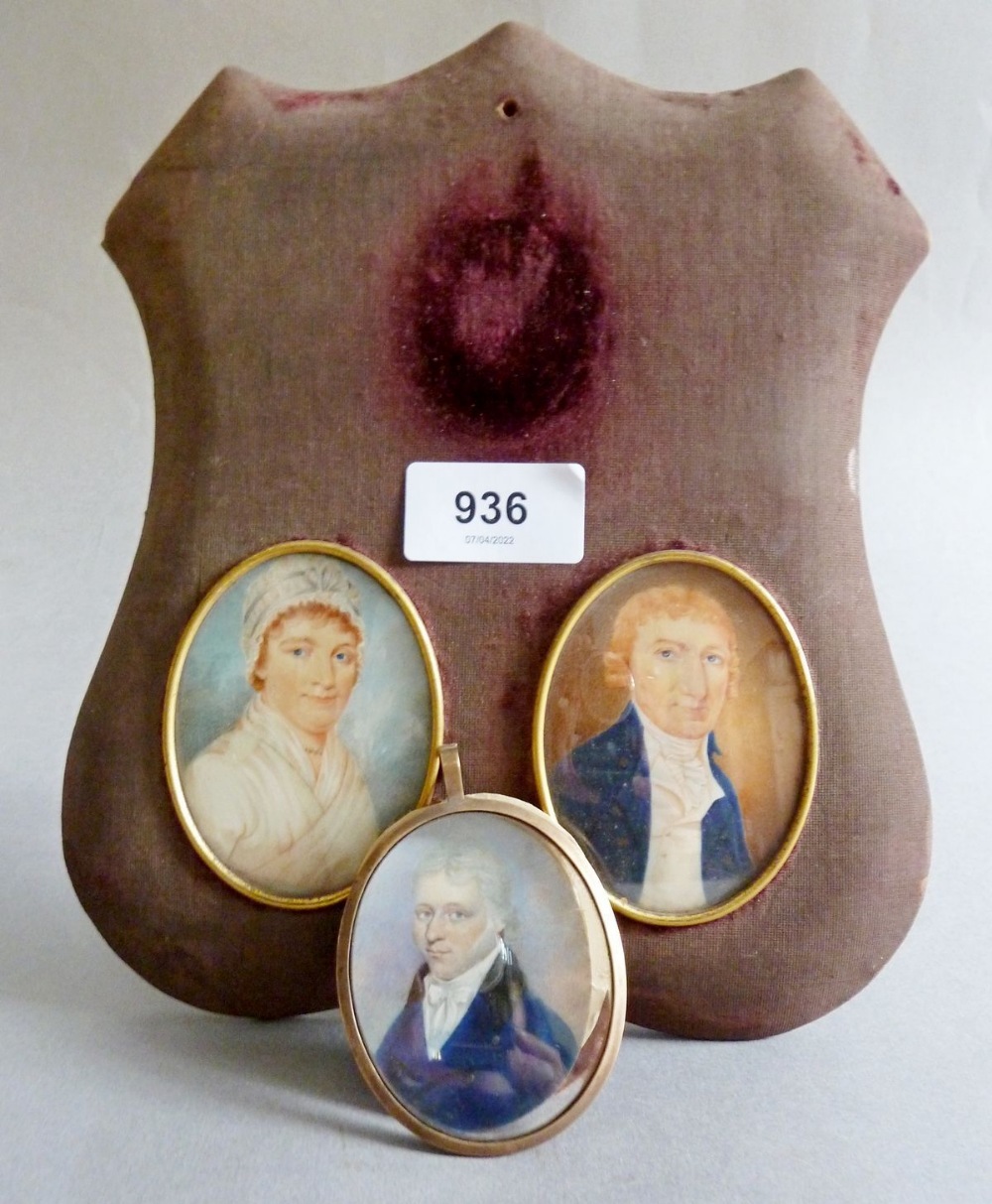 A pair of early 19th century watercolour on ivory miniatures of gentleman and a lady and a further