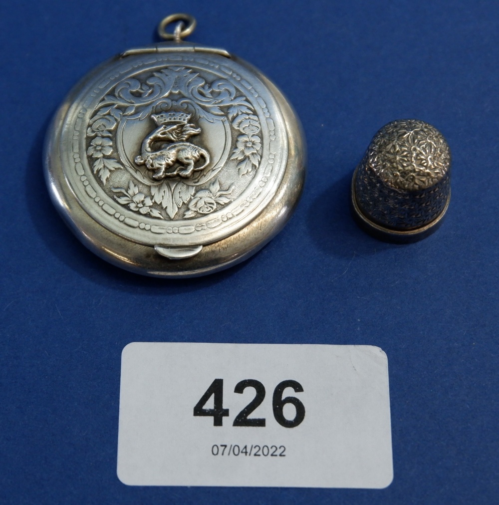 A silver pendant compact with dragon crest, 4cm diameter - unmarked 13.5g and a child's silver