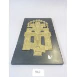 A cast brass icon plaque of Christ on the cross inset into black panel, 31 x 18.5cm