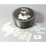 A lacquer box with mother of pearl bird decoration to lid and various Chinese mother of pearl gaming