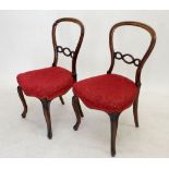 A pair of Victorian balloon back side chairs with interlaced splats