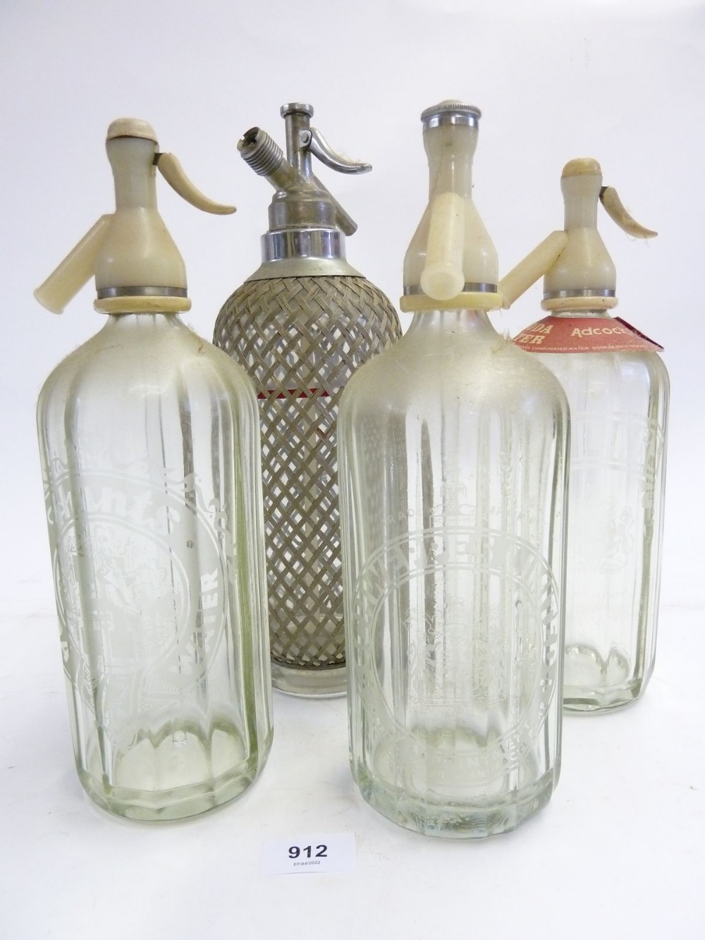 Four various antique and vintage soda siphons