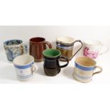 A group of five Victorian mugs including Mocha Ware, blue and white Ironbridge scene etc all damaged