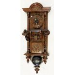 A 19th century 'Black Forrest' finely carved mahogany wall mounted telephone, 65cm tall approx.