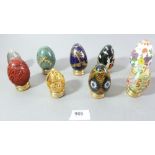 A collection of Franklin mint eggs