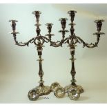 A pair of Victorian silver plated three branch candelabra with engraved decoration and four