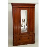 A Victorian mahogany mirror door wardrobe with drawer under, 115cm wide approx.