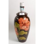 A Moorcroft table lamp painted hibiscus on a brown ground 26cm tall