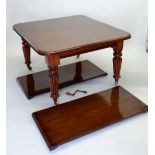 A Victorian large mahogany wind out dining table on fluted supports with two interleaves, 238 x