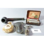 An Imperial pipe, pipe reamer, a safety razor and a smelling salts bottle
