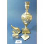 A silver plated baluster form candlestick and a silver plated vesta, miniature elephant and dome top