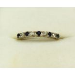 A gold ring line set sapphires and diamonds (marks rubbed) size O, 2.2g