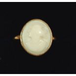 A antique yellow metal ring set carved shell cameo, size P