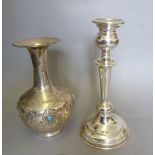 A silver candlestick, 17cm and a white metal vase inset turquoise