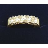 An 18 carat gold five stone diamond ring, size R to S, 7.6g