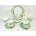 An Aynsley 'Sherwood' tea service comprising teapot, milk, sugar, cake plate, six tea plates and six