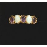 A 9 carat gold opal and amethyst five stone ring