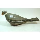 An antique carved and painted pigeon decoy, 41cm
