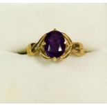 A 9 carat gold ring set oval cut amethyst, size L, 1.9g