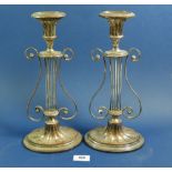 A pair of 19th century silver plated lyre form candlesticks, 32cm