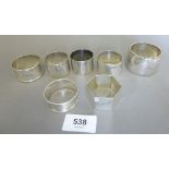 Seven various silver napkin rings, 111g