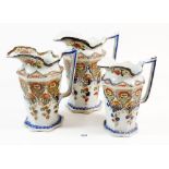 A set of three graduated jugs by T R & Co, smallest 18cm