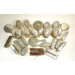 A large group of silver brushes, mirrors etc.