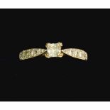 A 9 carat gold ring set square diamond on diamond chip shoulders, size T, 2.8g