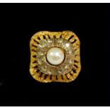 A vintage gold ring set pearl within white stone/diamond surround, size H, 6.2g