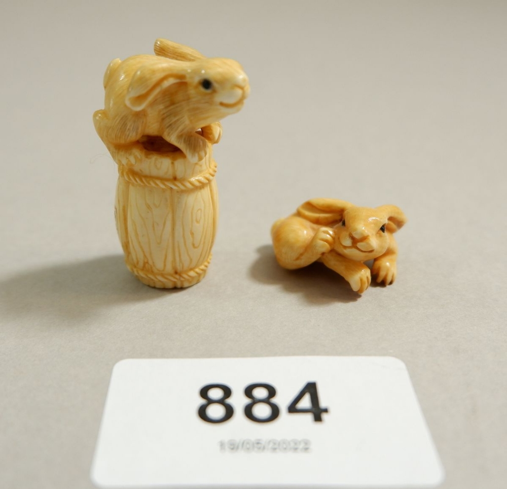 A Japanese Meiji period ivory netsuke of a rabbit on a barrel, 3.5cm tall, signed and a miniature