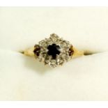 A 9 carat gold sapphire and chip diamond cluster ring, size O