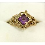 A 9 carat gold ring set amethyst in 'pitted' setting, size Q, 5.4g