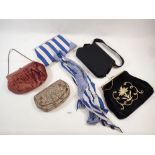 A beaded 1920's evening bag and four other bags including 1980's blue striped bag with matching