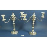 A pair of three branch candelabra with interchangeable branches and sconces